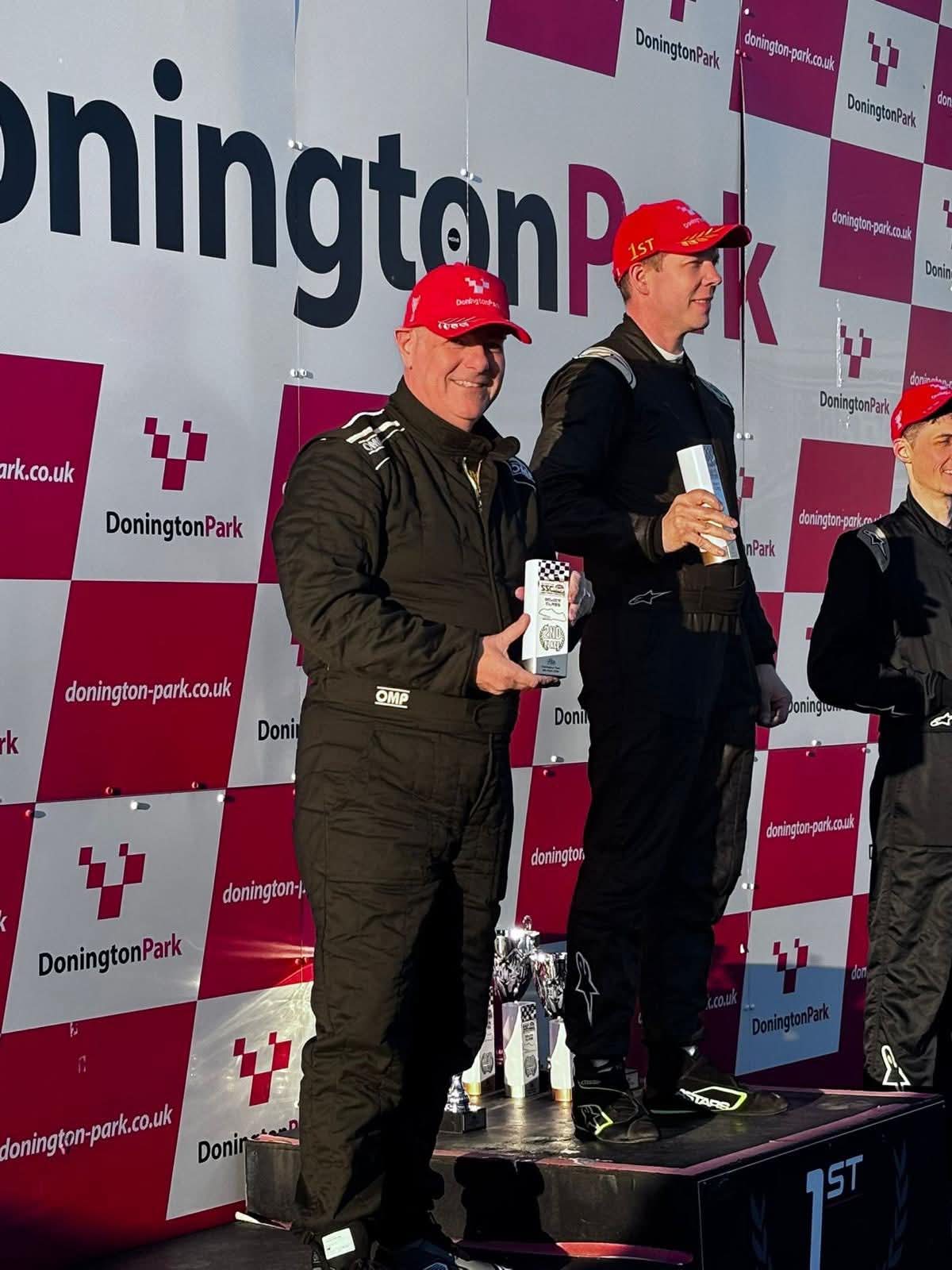 Darren Lucas celebrating on the podium after round 1